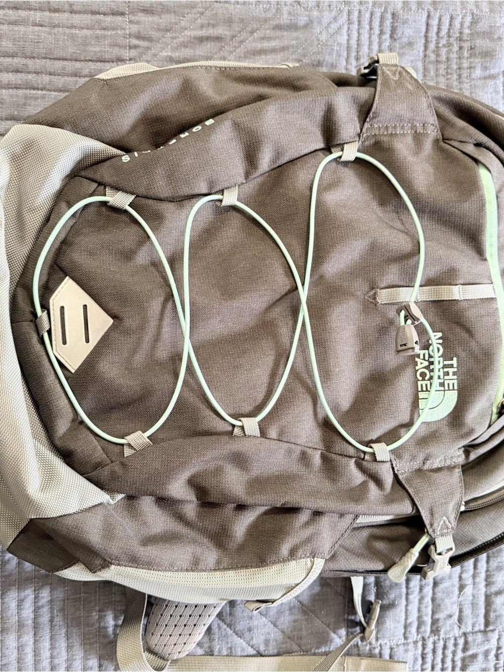 The North Face gray Backpack with Light Green Bungee Cord